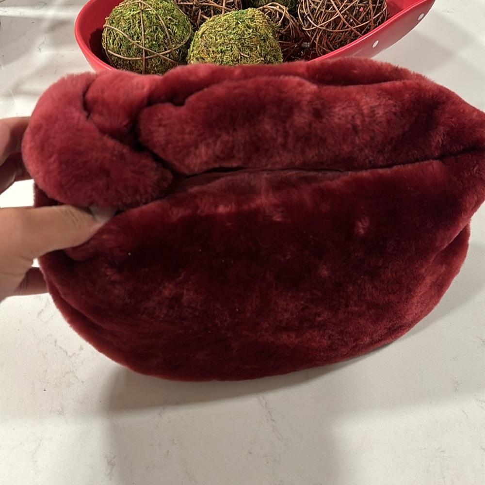 Small wine colored fur handbag